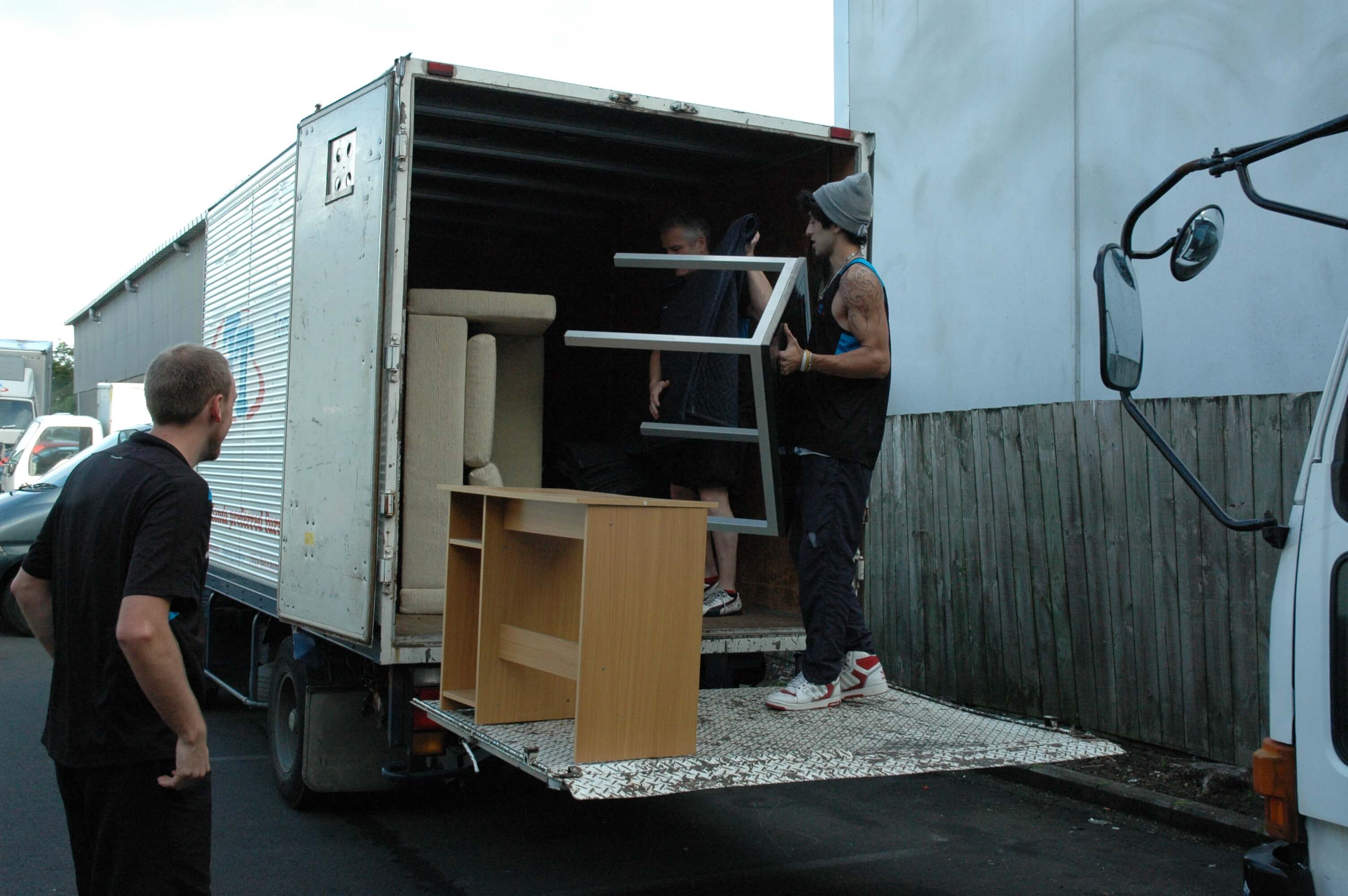 Home Movers putting furnitire in a moving truck in Auckland.